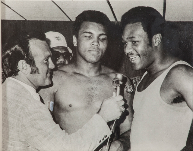 Black and White photo of Jerry Gross interviewing Muhammad Ali and George Foreman